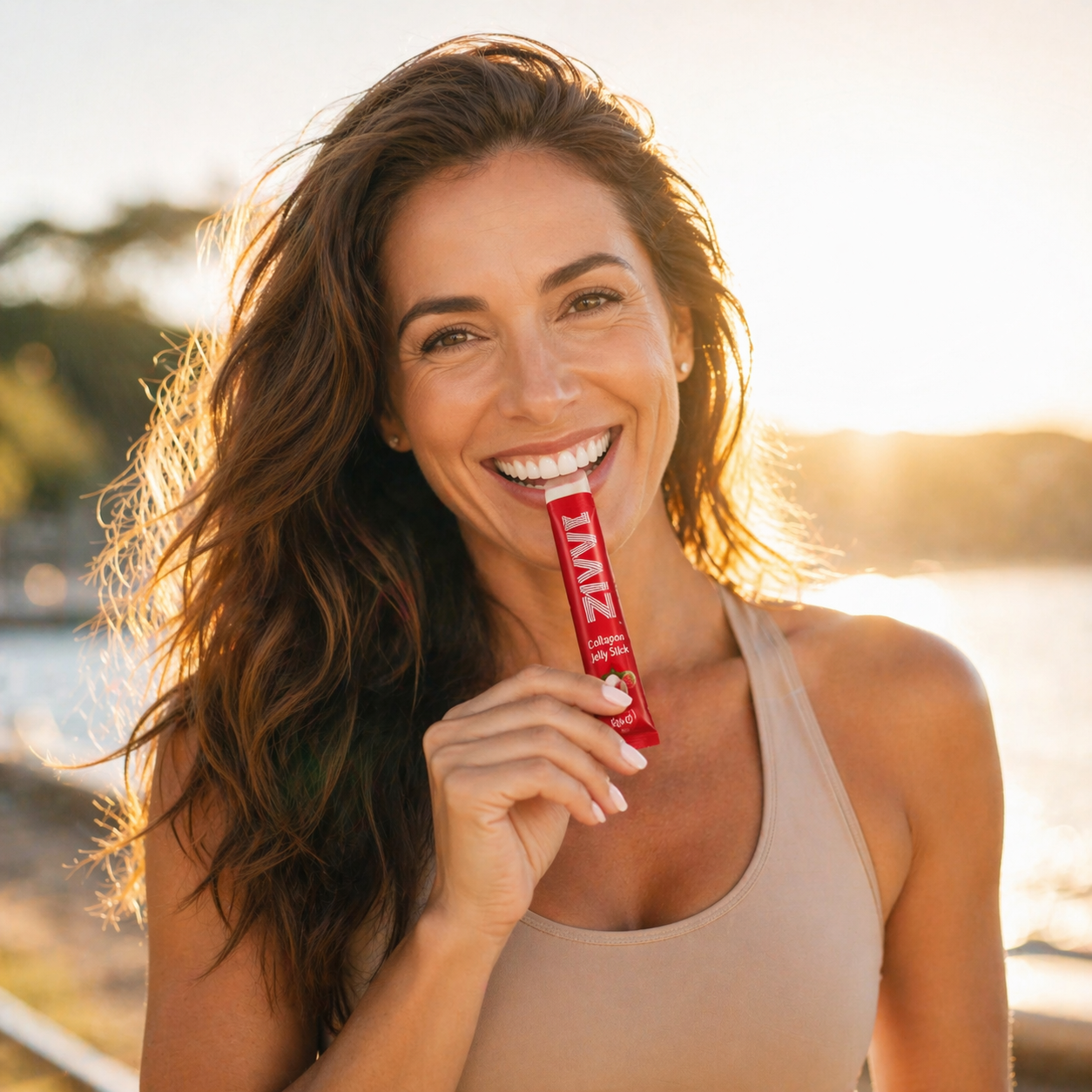 Woman smiling outdoors with collagen jelly stick